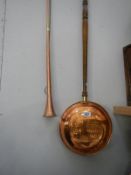 A copper post horn and a copper warming pan