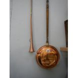 A copper post horn and a copper warming pan