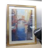A gilt framed print of Venice
