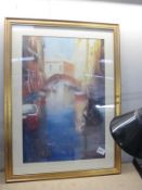 A gilt framed print of Venice