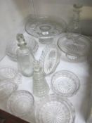 A good lot pf glassware including decanters, cake stands etc.