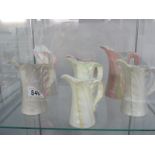 A collection of 7 Royal Worcester jugs