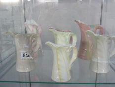 A collection of 7 Royal Worcester jugs