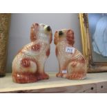 A pair of Staffordshire Pottery dogs