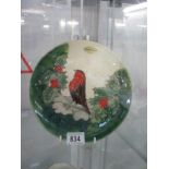 A Moorcroft Christmas plate featuring a robin and holly ****Condition report**** A