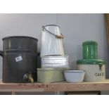 A quantity of vintage tin and enamel kitchenware including cakes,