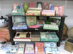 4 shelves of boxed and unboxed vintage soap / talcum powder etc.