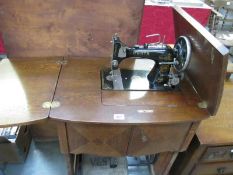 A Vesta treadle sewing machine (SERIAL NO 1441 544) in cabinet (no drive belt,