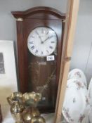 A modern AMS dark wood clock