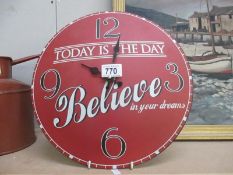 A vintage 'Believe' clock