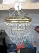 A vintage 3 tier chandelier with glass droppers