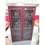 A glazed 2 door cabinet