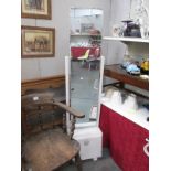 A vintage mirror with cabinet base