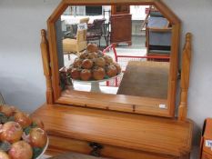 A pine dressing table mirror with drawer