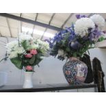 2 vases with artificial flowers