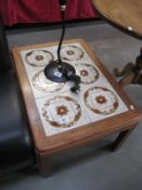 A continental tile top teak coffee table