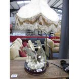 A Juliana collection table lamp featuring wolves and tassel shade