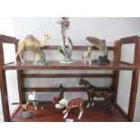 A collection of Beswick animals, all damaged with some repaired including Camel, Salmon, Donkey,