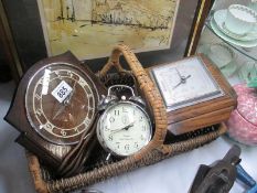 A basket of vintage clocks etc