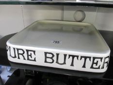 An early 20th century Pure Butter shop display stand marked G Rushbrook,