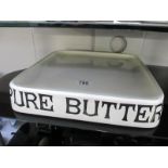 An early 20th century Pure Butter shop display stand marked G Rushbrook,