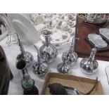 A collection of polished silver flasks and cannisters etc