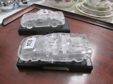 2 glass car models on bases being a Porsche 959 and Ferrari Testarossa