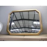 A gilt framed mirror