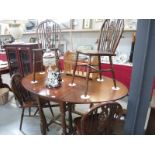 An oval dining table and 4 chairs