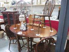 An oval dining table and 4 chairs