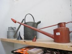 A quantity of watering cans