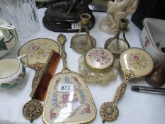 A vintage tapestry backed dressing table set including candlesticks