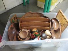 A box of wooden and treen items including letter rack, Russian doll etc.