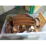 A box of wooden and treen items including letter rack, Russian doll etc.