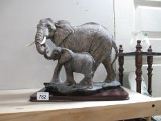 A lovely Academy Elephant and Baby figure on wooden base