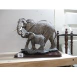 A lovely Academy Elephant and Baby figure on wooden base