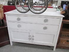 A 2 drawer 2 door white painted cupboard