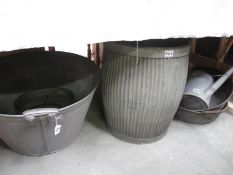A vintage steel bath tub, 2 large handled pans, griddle,
