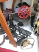A collection of metal irons, trivets etc.
