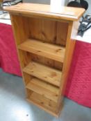 A small 4 shelf pine book case