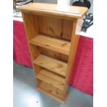 A small 4 shelf pine book case