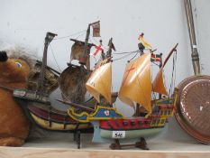 Two models of ships on stands