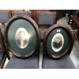 A pair of oval portraits