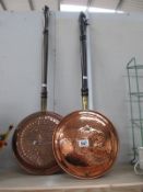 Two copper warming pans