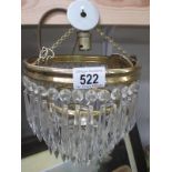 A vintage 3 tier chandelier with glass droppers