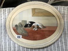 An oval framed picture of a pair of Spaniels