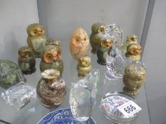 A collection of glass an stone owl figures etc.