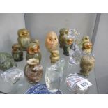 A collection of glass an stone owl figures etc.