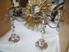 A pair of silver plate candelabras