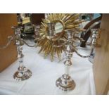 A pair of silver plate candelabras